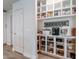 Organized pantry shelving providing ample storage space for kitchen essentials and appliances at 21188 N Duncan Dr, Maricopa, AZ 85138