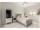 This bedroom features carpet floors, a ceiling fan, and lots of natural light at 24035 N 171St Dr, Surprise, AZ 85387