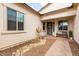 Inviting front porch with desert landscaping, a bench, and stylish front door at 24035 N 171St Dr, Surprise, AZ 85387