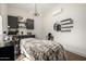 Bright room with massage table, a chair and shelves with cosmetic products at 24035 N 171St Dr, Surprise, AZ 85387