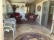 Comfortable sunroom featuring tile floors, multiple seating arrangements, and sliding glass doors at 2405 N Eastwood Way, Mesa, AZ 85215
