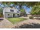 Large backyard with green grass, neutral-tone gravel, and a trampoline offers outdoor enjoyment at 2562 E Los Alamos St, Gilbert, AZ 85295
