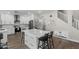 Bright kitchen with a large island, white cabinetry, and stainless steel appliances at 2562 E Los Alamos St, Gilbert, AZ 85295