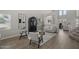 Bright, neutral living room with wood floors, high ceilings, and stylish decor at 2562 E Los Alamos St, Gilbert, AZ 85295
