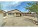 Backyard with a storage shed, covered patio, and xeriscape landscaping at 25729 W St Charles Ct, Buckeye, AZ 85326