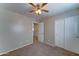 Carpeted bedroom with walk-in closet and ensuite bathroom access at 25729 W St Charles Ct, Buckeye, AZ 85326