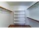 Walk-in closet featuring custom built-in shelving and clothing racks at 25729 W St Charles Ct, Buckeye, AZ 85326