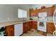 Practical kitchen design showcasing ample counter space, wooden cabinets, and essential appliances at 25729 W St Charles Ct, Buckeye, AZ 85326