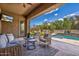 Relaxing back patio with a beautiful pool and green backyard, perfect for outdoor entertaining at 2604 W Balao Dr, Phoenix, AZ 85085