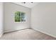 Empty bedroom with a window and carpet at 2604 W Balao Dr, Phoenix, AZ 85085