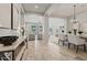 Open-concept living area with tiled flooring, neutral decor, and ample natural light offers a welcoming space at 2604 W Balao Dr, Phoenix, AZ 85085