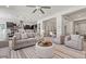Bright living room with neutral tones, comfortable seating, and open layout to the kitchen is perfect for relaxing at 2604 W Balao Dr, Phoenix, AZ 85085