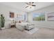 Bright and airy main bedroom featuring neutral tones, large windows, and ample space at 2604 W Balao Dr, Phoenix, AZ 85085