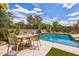 Beautiful backyard pool with a dining area for relaxation and outdoor dining at 2604 W Balao Dr, Phoenix, AZ 85085