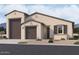 Inviting single-story home with a two-car garage, neutral stucco facade, and meticulously landscaped front yard at 2639 E Rustler Rd, San Tan Valley, AZ 85140