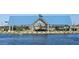 Community pavilion with picnic tables situated on the lake at 2639 E Rustler Rd, San Tan Valley, AZ 85140