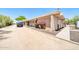 Exterior view of a single-story home with desert landscaping and a private driveway at 27250 N 64Th St # 16, Scottsdale, AZ 85266