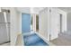Entrance foyer with a blue accent door and view into other rooms at 27250 N 64Th St # 16, Scottsdale, AZ 85266