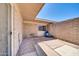 Enclosed patio space with a blue chair, offering a private outdoor retreat at 27250 N 64Th St # 16, Scottsdale, AZ 85266