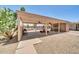 Community patio with seating, ceiling fans, cacti, and views of the community pool at 27250 N 64Th St # 16, Scottsdale, AZ 85266