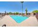 Community pool with lounge chairs and desert landscaping, perfect for relaxation under the Arizona sun at 27250 N 64Th St # 16, Scottsdale, AZ 85266
