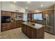 Spacious kitchen boasting custom cabinetry, stainless steel appliances, and a granite-topped island at 2919 E Friess E Dr, Phoenix, AZ 85032