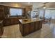 Well-equipped kitchen with a large island, stainless appliances, and an adjacent breakfast area at 2919 E Friess E Dr, Phoenix, AZ 85032