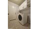 Bright and spacious laundry room with cabinetry, modern washer/dryer and utility sink at 2919 E Friess E Dr, Phoenix, AZ 85032