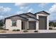 Charming single-story home featuring a neutral color palette, multiple car garage, and landscaped front yard at 32071 N Lone Rancher Way, San Tan Valley, AZ 85140