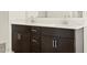 Bathroom featuring a modern vanity with double sinks and brushed nickel hardware at 4035 S 176Th Dr, Goodyear, AZ 85338
