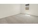 A bright bedroom with neutral carpet and a window that lets in natural light at 4035 S 176Th Dr, Goodyear, AZ 85338