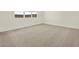 Bedroom featuring neutral carpet, bright white walls and window at 4035 S 176Th Dr, Goodyear, AZ 85338