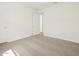 This bright bedroom features neutral carpet, white walls, and a closet or doorway leading to another room at 4035 S 176Th Dr, Goodyear, AZ 85338
