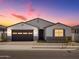 Charming single-story home featuring a two-car garage and desert landscaping in a peaceful neighborhood at 4035 S 176Th Dr, Goodyear, AZ 85338