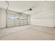A large garage with an automatic door that allows in natural light at 4035 S 176Th Dr, Goodyear, AZ 85338