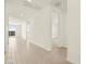 Bright hallway with tile flooring leading to carpeted bedrooms and a view of the backyard at 4035 S 176Th Dr, Goodyear, AZ 85338