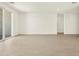 Bright and airy living room featuring tile flooring, recessed lighting, and sliding glass doors for seamless indoor-outdoor living at 4035 S 176Th Dr, Goodyear, AZ 85338