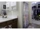 Comfortable bathroom includes a shower, ample counter space, and closet space at 42006 W Hillman Dr, Maricopa, AZ 85138