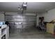 Spacious garage with insulated garage door, perfect for storage and projects at 42006 W Hillman Dr, Maricopa, AZ 85138