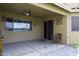 This covered patio boasts a ceiling fan, with easy access from the living room at 42006 W Hillman Dr, Maricopa, AZ 85138