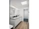 Elegant bathroom with a marble countertop vanity, double sinks, and a glass-enclosed shower at 4336 E Piccadilly Rd, Phoenix, AZ 85018