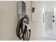 Electric car charging station attached to a wall near the carport at 4336 E Piccadilly Rd, Phoenix, AZ 85018