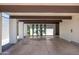 Wide carport with painted white columns, wooden beams, and desert landscaping at 4336 E Piccadilly Rd, Phoenix, AZ 85018