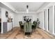 A modern dining room with stylish chairs, an elegant light fixture, and a chic buffet at 4336 E Piccadilly Rd, Phoenix, AZ 85018