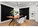 Home office features black out shades, a view of the yard, and built-in shelving at 4336 E Piccadilly Rd, Phoenix, AZ 85018