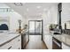 Bright kitchen with white cabinets, stone countertops, and an open design at 4336 E Piccadilly Rd, Phoenix, AZ 85018
