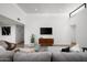 Inviting living room with high ceilings, stylish furniture, and plenty of natural light at 4336 E Piccadilly Rd, Phoenix, AZ 85018