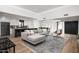 An open-concept living room showcases modern design and seamless flow into the gourmet kitchen at 4336 E Piccadilly Rd, Phoenix, AZ 85018
