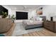 Comfortable main bedroom with a plush bed, modern decor, and plenty of natural light at 4336 E Piccadilly Rd, Phoenix, AZ 85018