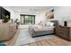 Cozy main bedroom with a comfortable bed, stylish rug, and modern decor at 4336 E Piccadilly Rd, Phoenix, AZ 85018